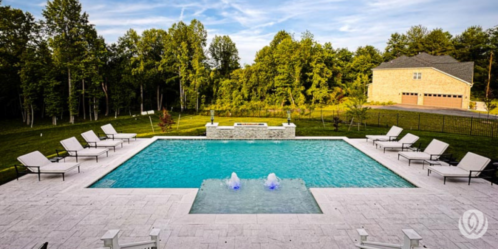 Large backyard pool with lounge chairs